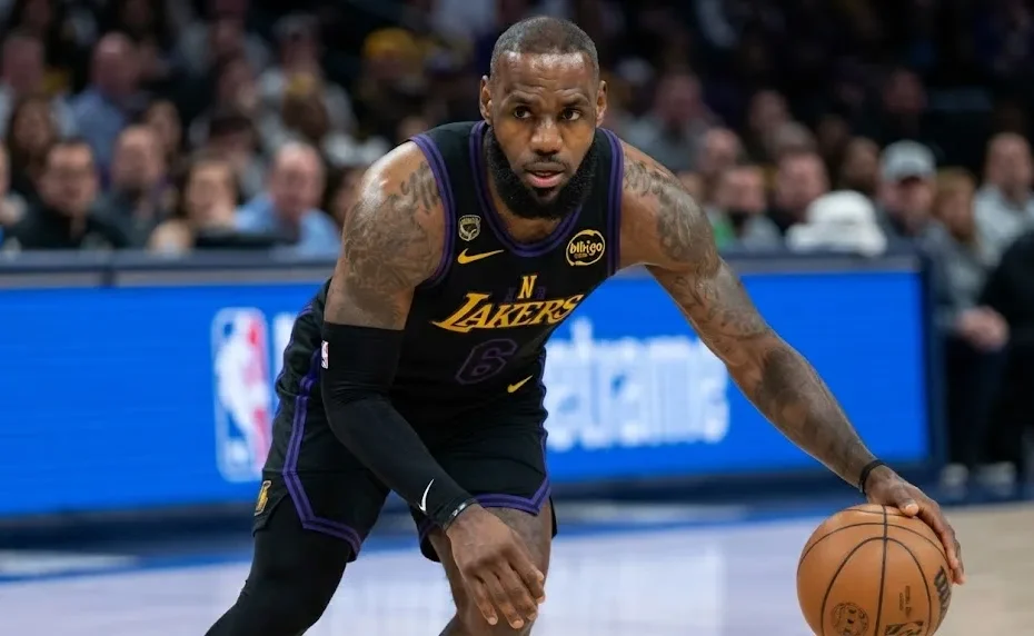 High-resolution horizontal action shot of LeBron James tracking stats for the Los Angeles Lakers on the court.